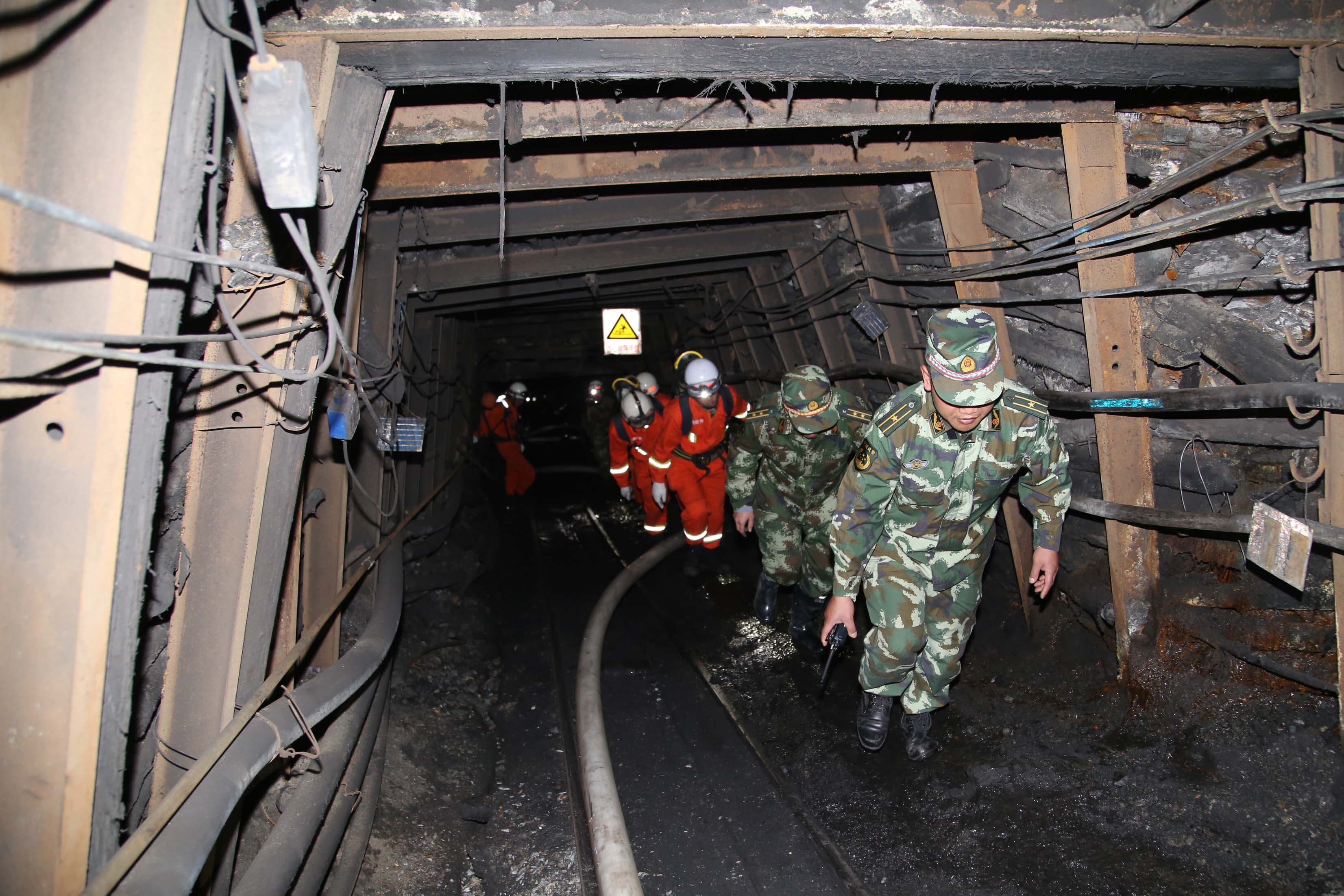 QUJING, CHINA - APRIL 07: (CHINA OUT) Rescuers race against time to pump water from a flooded coal mine where 22 miners were trapped underground on April 7, 2014 in Qujing, Yunnan Province of China. A mining zone of the Xiahaizi Coal Mine was flooded while 26 miners were working at 4:50 am. Only four miners managed to escape, 22 coal miners were trapped underground. (Photo by ChinaFotoPress/ChinaFotoPress via Getty Images)