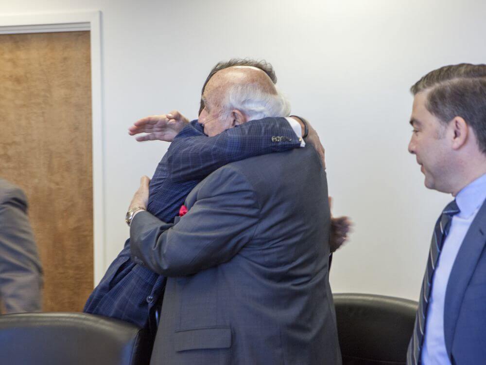 This March 29, 2017, photo obtained by the Associated Press, shows Robert Murray of Murray Energy, right, hugging Energy Secretary Rick Perry at the Department of Energy headquarters in Washington. (Simon Edelman, Dept. of Energy via AP)