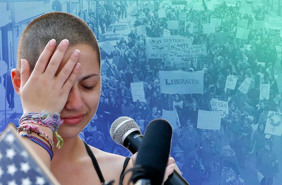 TOPSHOT - Marjory Stoneman Douglas High School student Emma Gonzalez reacts during her speech / AFP PHOTO / RHONA WISE (Photo credit should read RHONA WISE/AFP/Getty Images)