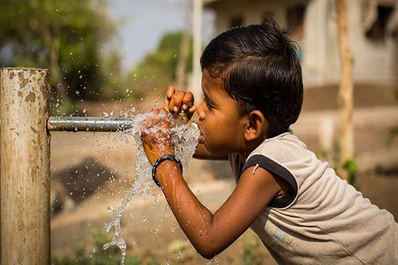 boy-drinking-water-from-a-pipe