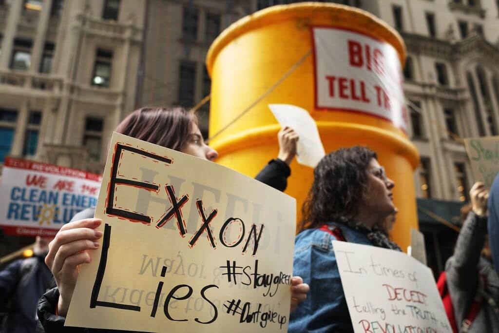 NEW YORK, NY - FEBRUARY 22: Activists rally outside of State Attorney General Eric Schneiderman's office to support the New York state investigation into whether the oil giant Exxon covered up its knowledge about climate change on February 22, 2017 in New York City. Over a dozen activists representing hundreds of environmental, civic and college student organizations used a blow-up oil barrel to emphasize the importance of the ongoing investigation which is headed by the Attorney General. (Photo by Spencer Platt/Getty Images)
