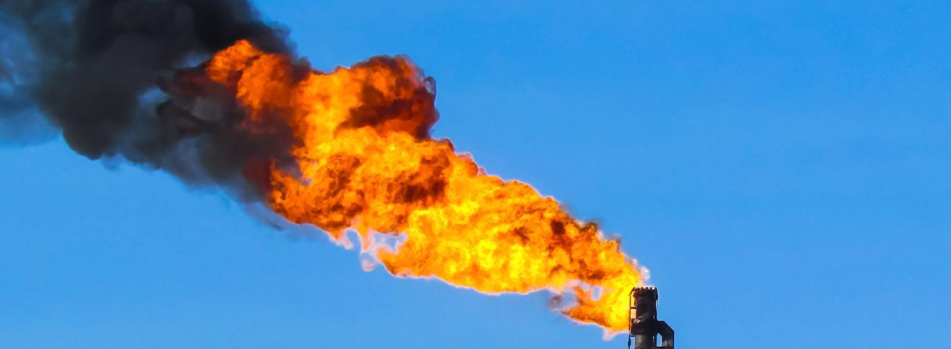 Torch system on an oil field - flare - cropped 1600w - iStock-636344438
